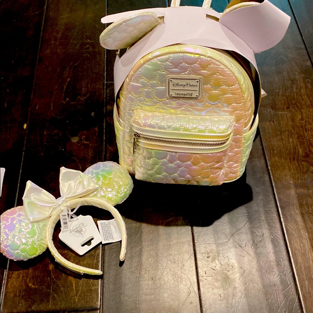 Disney white lounge fly backpack with Trendy Holographic Finish and matching ear